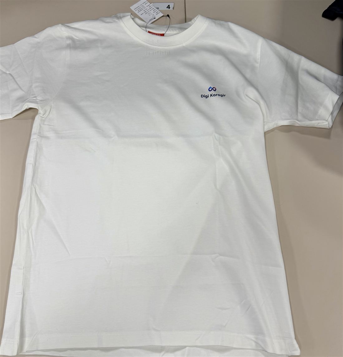 Official DigiKaragir T-shirt — front, left-chest crest
